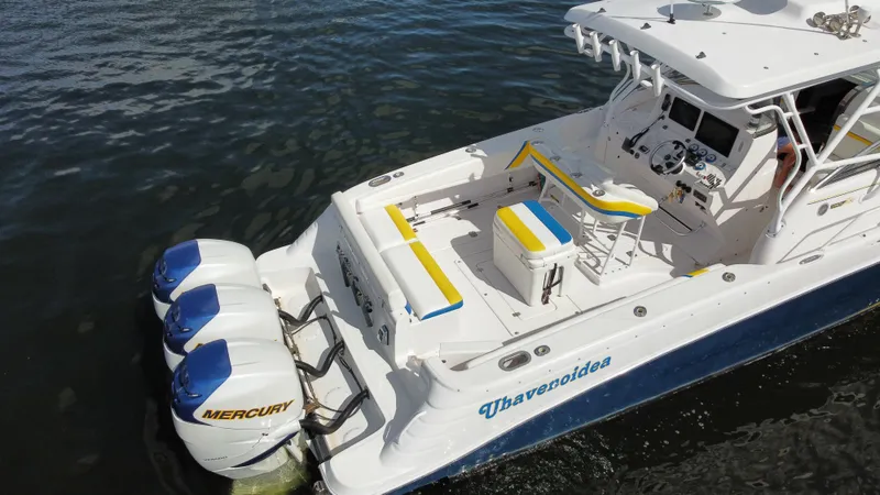 Slide: The Image of 2006 Donzi 38 ZSF boat with triple Mercury engines on water. - 14