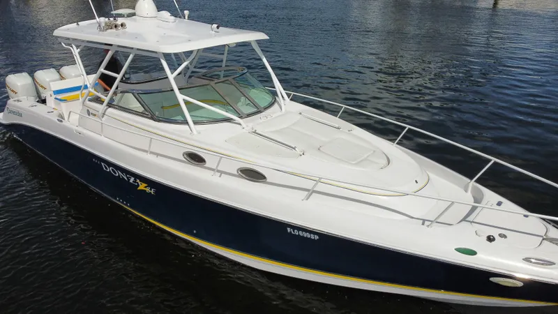 Slide: The Image of 2006 Donzi 38 ZSF boat on water, featuring sleek design and spacious deck. - 15