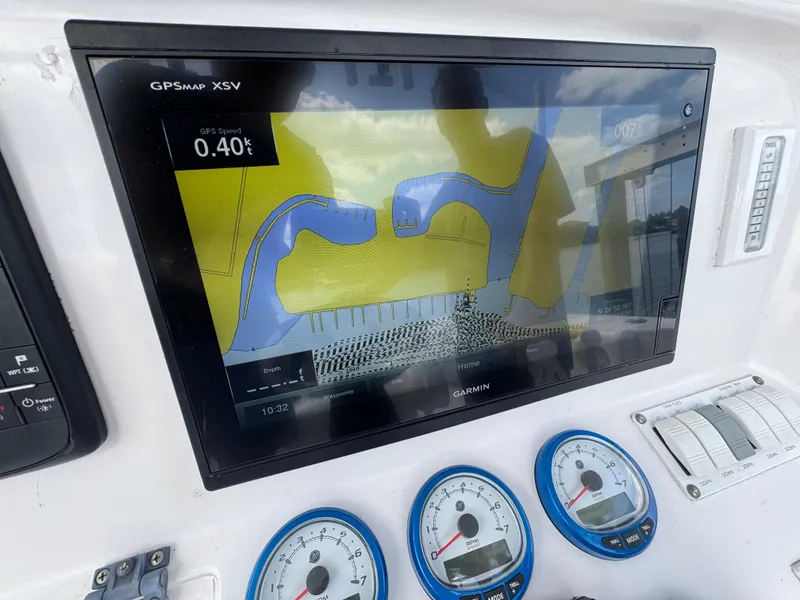 Slide: The Image of GPS navigation system on 2006 Donzi 38 ZSF boat dashboard with gauges. - 21