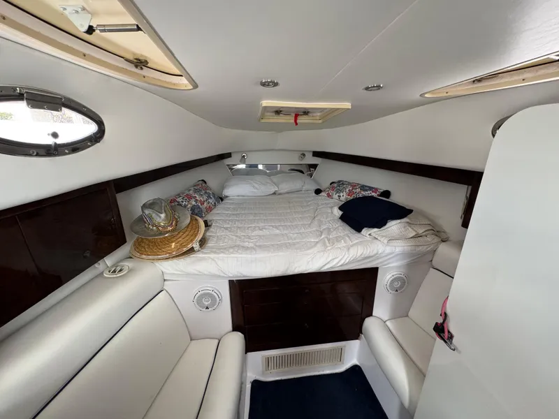 Slide: The Image of Interior cabin of 2006 Donzi 38 ZSF boat with cozy bed and seating. - 23