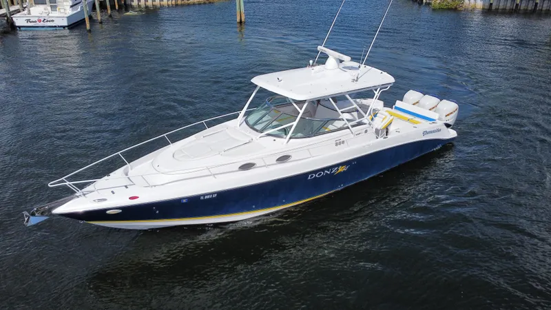 Slide: The Image of 2006 Donzi 38 ZSF boat on water, featuring sleek design and powerful engines. - 5