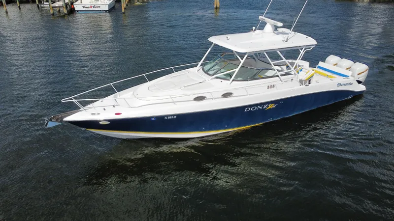 Slide: The Image of 2006 Donzi 38 ZSF boat on water, featuring sleek design and powerful engines. - 6