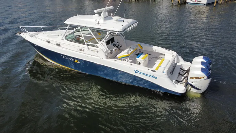 Slide: The Image of 2006 Donzi 38 ZSF boat with Mercury engines on the water. - 9