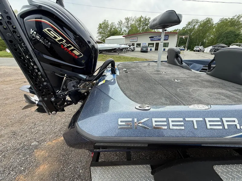 Slide: The Image of 2023 Skeeter ZXR20 boat with Yamaha engine, parked outdoors near dealership. - 11