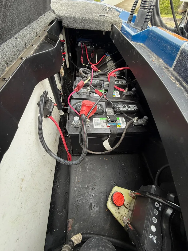Slide: The Image of 2023 Skeeter ZXR20 boat battery compartment with wiring and components. - 5
