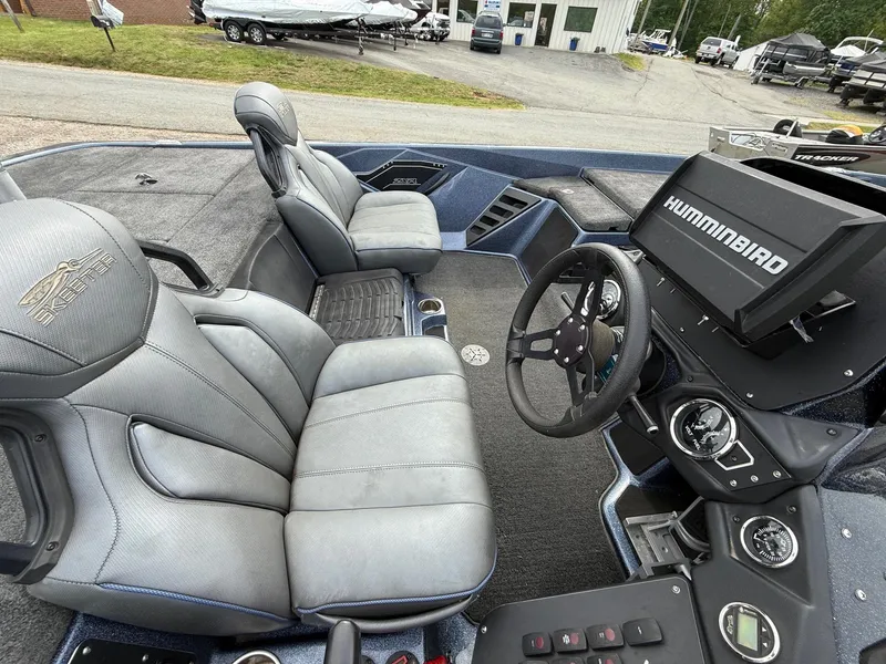 Slide: The Image of 2023 Skeeter ZXR20 boat interior with steering wheel and Hummingbird electronics. - 7