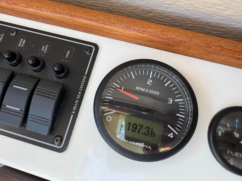 Slide: The Image of Control panel of 2016 Ranger Tugs R-21EC with RPM gauge showing 197.3 hours. - 24