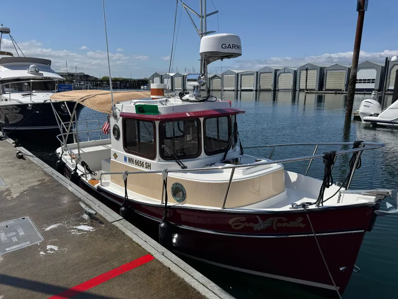 Slide: The Image of 2016 Ranger Tugs R-21EC boat docked at marina with Garmin equipment. - 4