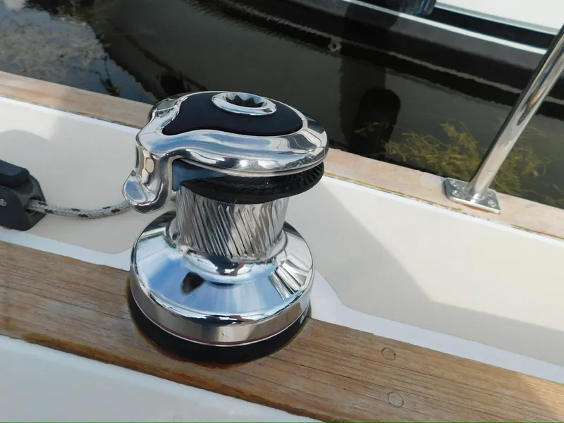 Slide: The Image of Chrome winch on 2014 Tartan Fantail sailboat deck, reflecting sunlight. - 19