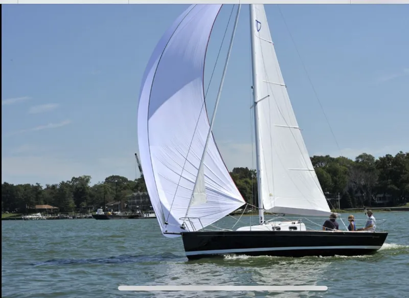 Slide: The Image of Sailing on a 2014 Tartan Fantail boat with white sails on a sunny day. - 3