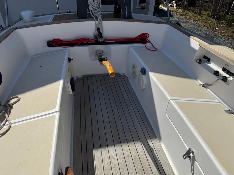 Slide: The Image of 2014 Tartan Fantail sailboat cockpit with wooden flooring and seating. - 32