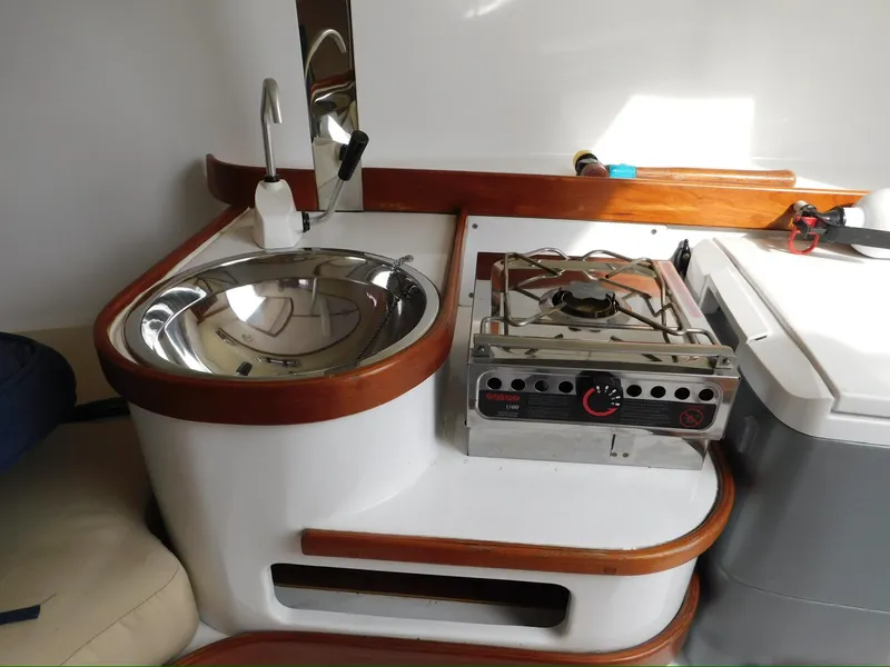 Slide: The Image of Compact kitchen area in a 2014 Tartan Fantail boat with sink and stove. - 4