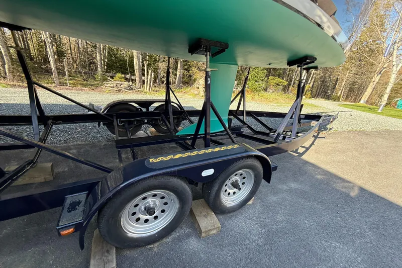 Slide: The Image of Trailer supporting a 2014 Tartan Fantail sailboat, parked on a paved surface. - 42