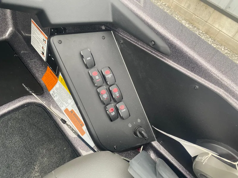 Slide: The Image of Control panel of 2025 Skeeter ZXR 21 SE boat with multiple switches. - 14