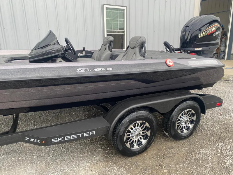 Slide: The Image of 2025 Skeeter ZXR 21 SE boat on trailer, featuring sleek design and dual seats. - 5