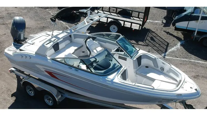 Slide: The Image of 2024 Chaparral 21 SSi OB boat on trailer, aerial view, sleek design. - 0