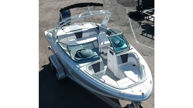 Slide: The Image of 2024 Chaparral 21 SSi OB boat with sleek design and spacious seating. - 1