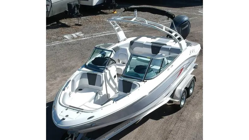 Slide: The Image of 2024 Chaparral 21 SSi OB boat on trailer, sleek design, white exterior. - 3