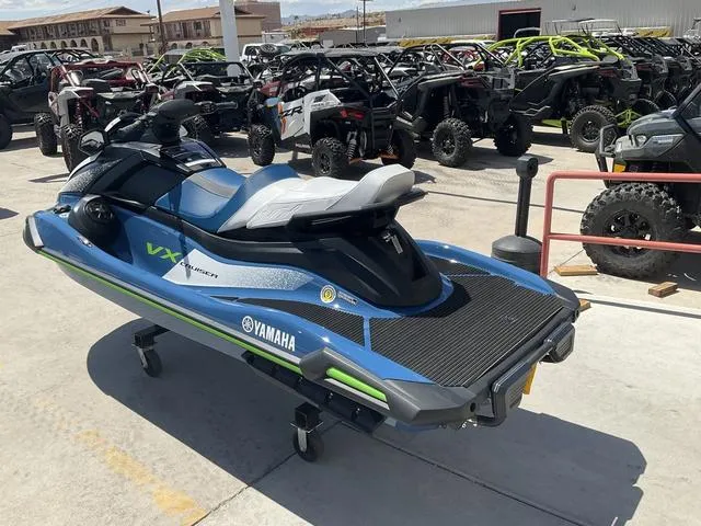 Slide: The Image of 2024 Yamaha Waverunner VX Cruiser in a showroom, surrounded by off-road vehicles. - 4