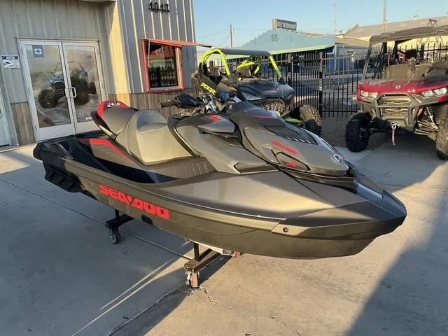 Slide: The Image of 2024 Sea-Doo Waverunner GTR™-X 300 Ibr in showroom, sleek design, black and red accents. - 2