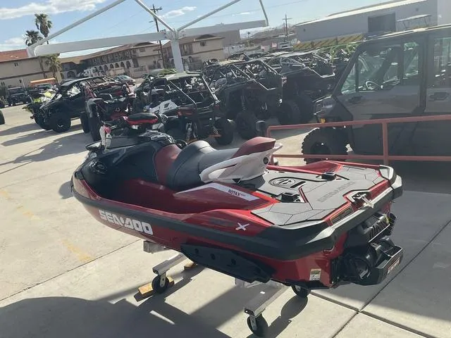 Slide: The Image of 2024 Sea-Doo Waverunner RXT in a showroom, surrounded by various off-road vehicles. - 4