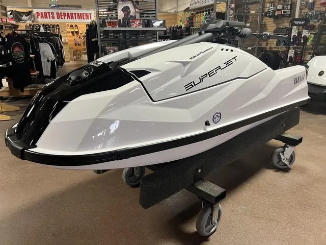 Slide: The Image of 2025 Yamaha Waverunners Superjet® displayed in a showroom on a wheeled stand. - 1