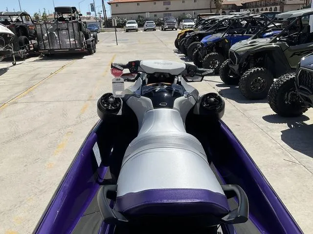 Slide: The Image of 2025 Sea-Doo Waverunner GTI SE 170 in a parking lot with other vehicles. - 4