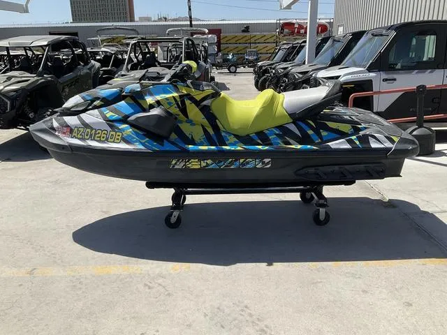 Slide: The Image of 2020 Sea-Doo Waverunner GTR™ 230 Ibr with vibrant graphics on display outdoors. - 4