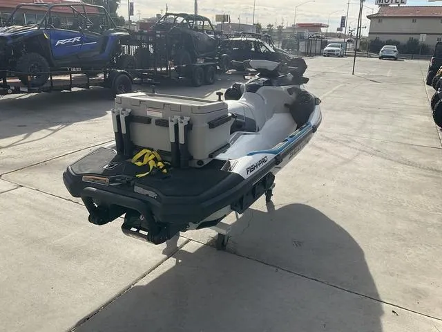 Slide: The Image of 2022 Sea-Doo Fish Pro Sport 170 jet ski with cooler, parked outdoors. - 3