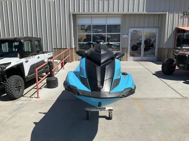 Slide: The Image of 2022 Yamaha Waverunner GP1800R SVHO in blue, parked outside a dealership. - 1