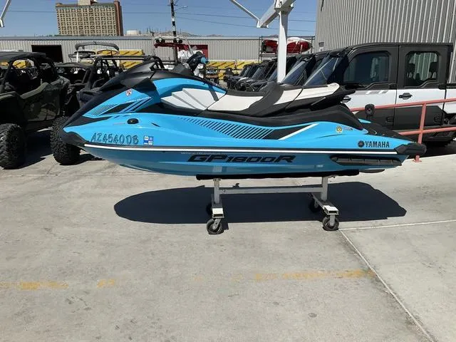 Slide: The Image of 2022 Yamaha Waverunner GP1800R SVHO in blue, displayed outdoors on a stand. - 4