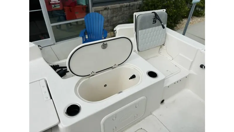 Slide: The Image of 2025 Carolina Skiff 21 LS boat interior with open storage compartment and seating. - 6