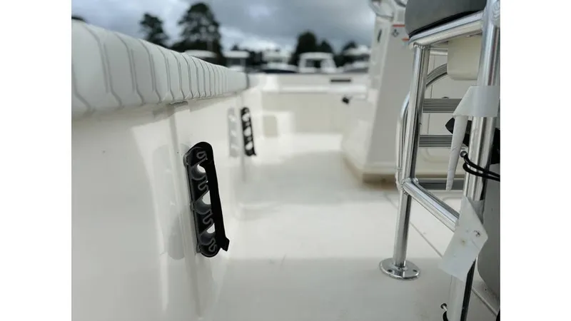 Slide: The Image of 2025 Carolina Skiff 21 LS boat interior with seating and railing, showcasing modern design. - 8