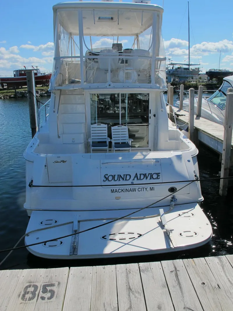 Slide: The Image of 1998 Sea Ray 480 Sedan Bridge docked in Mackinaw City, MI, named "Sound Advice." - 14