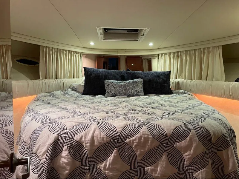 Slide: The Image of Luxurious bedroom interior of 1998 Sea Ray 480 Sedan Bridge yacht. - 6