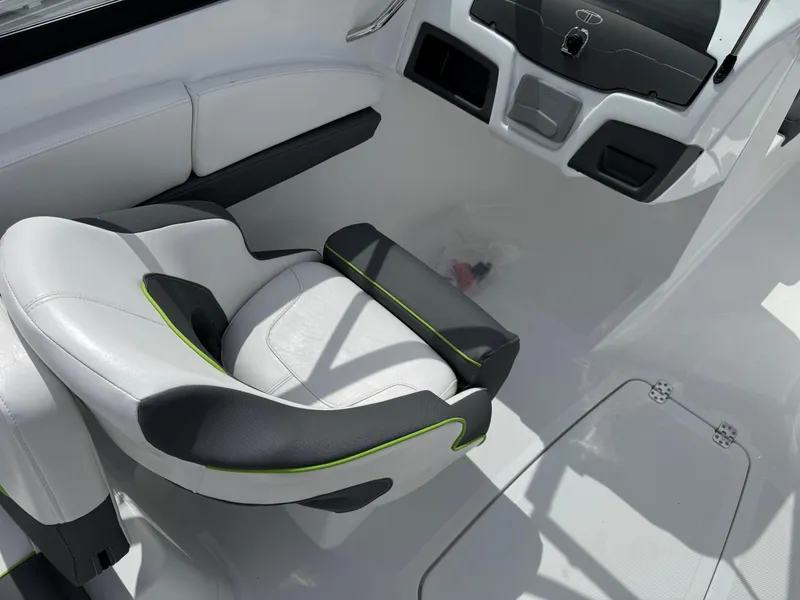 Slide: The Image of 2024 Tahoe 210 S boat interior with modern seating and dashboard design. - 14