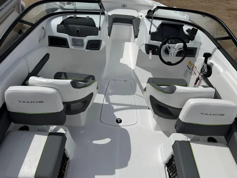 Slide: The Image of 2024 Tahoe 210 S boat dashboard with storage compartment and control panel. - 15