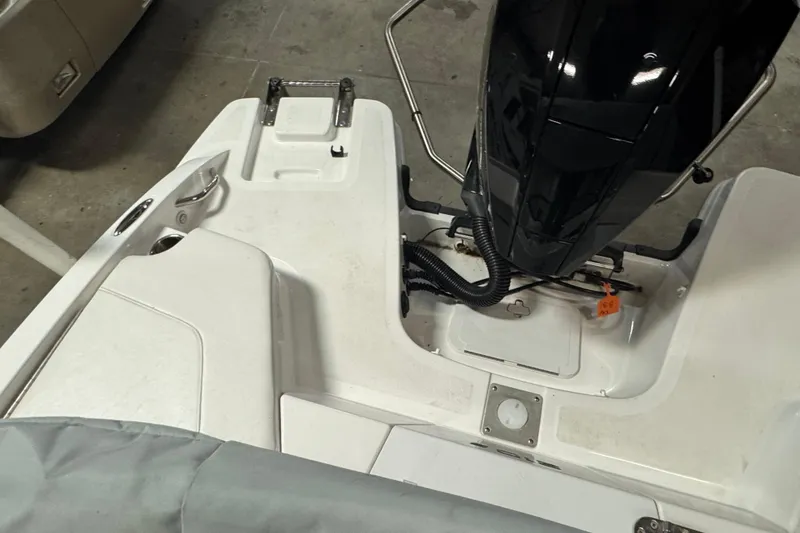 Slide: The Image of 2024 Tahoe 210 S boat engine area with sleek design and modern features. - 18