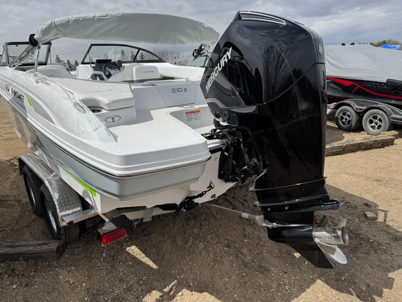 Slide: The Image of 2024 Tahoe 210 S boat with Mercury engine on trailer in storage facility. - 3
