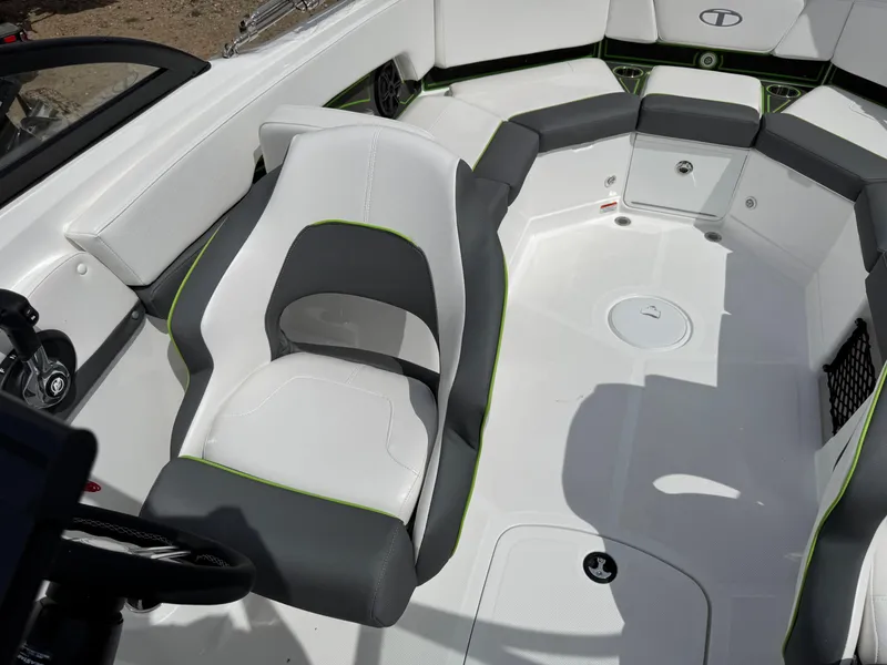 Slide: The Image of 2024 Tahoe 210 S boat with Humminbird Helix 7 fish finder in a garage setting. - 7