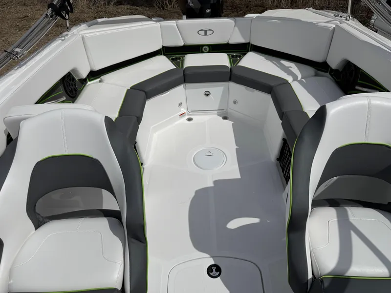 Slide: The Image of 2024 Tahoe 210 S boat dashboard with steering wheel and electronic displays. - 8