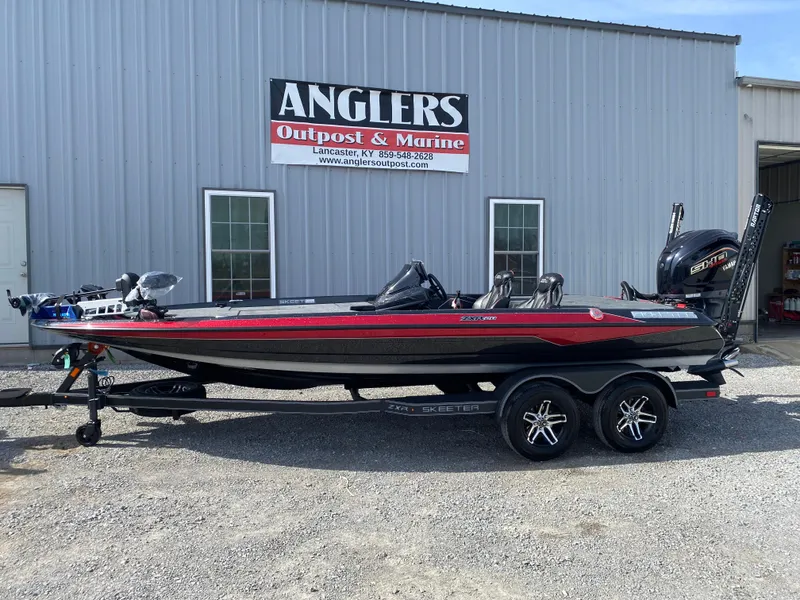 Slide: The Image of 2025 Skeeter ZXR 20 boat parked outside Anglers Outpost & Marine. - 1