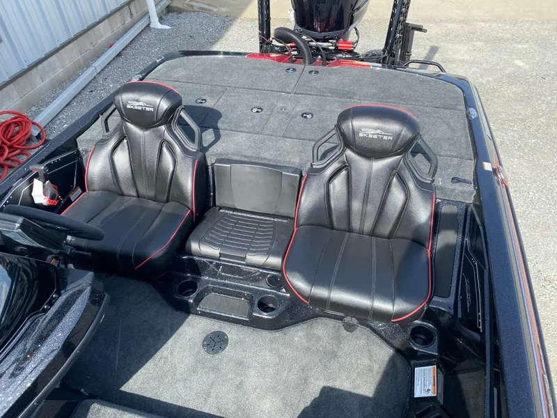 Slide: The Image of 2025 Skeeter ZXR 20 boat interior with black leather seats and red accents. - 10