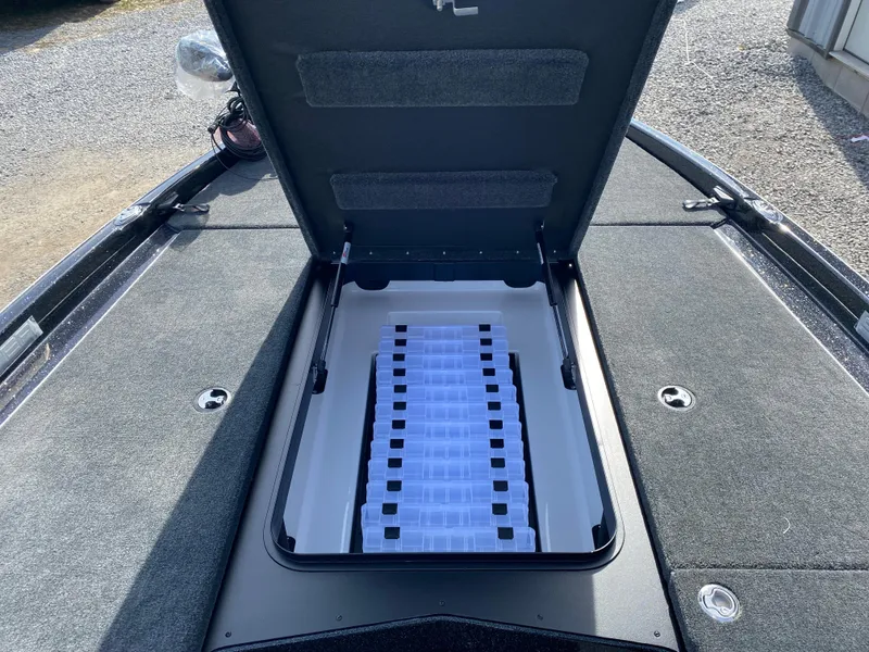 Slide: The Image of Open storage compartment on 2025 Skeeter ZXR 20 boat, showcasing organized interior space. - 12