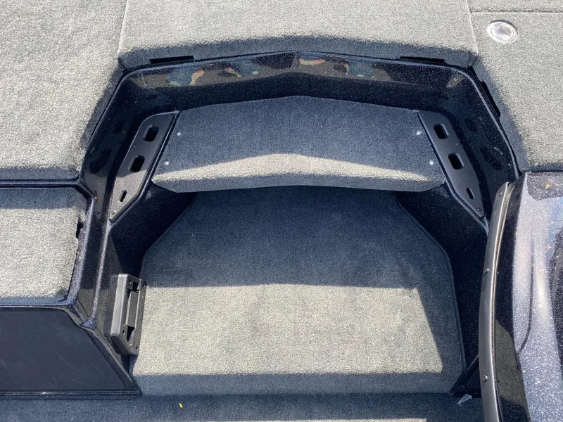 Slide: The Image of 2025 Skeeter ZXR 20 boat interior storage compartment with carpeted finish. - 14