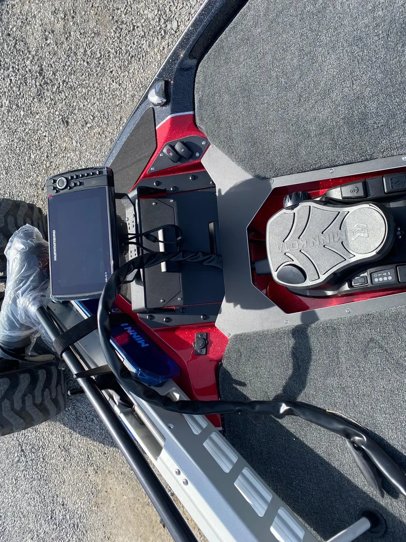 Slide: The Image of 2025 Skeeter ZXR 20 boat dashboard with electronic controls and navigation system. - 9