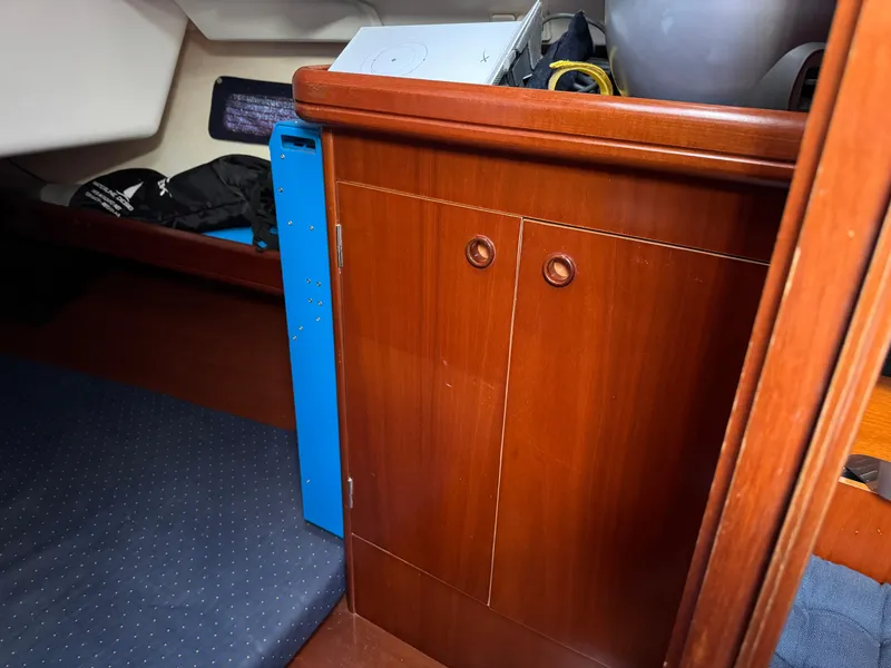 Slide: The Image of Interior cabin of 2002 Beneteau Oceanis Clipper 393 with wooden cabinetry and storage. - 13