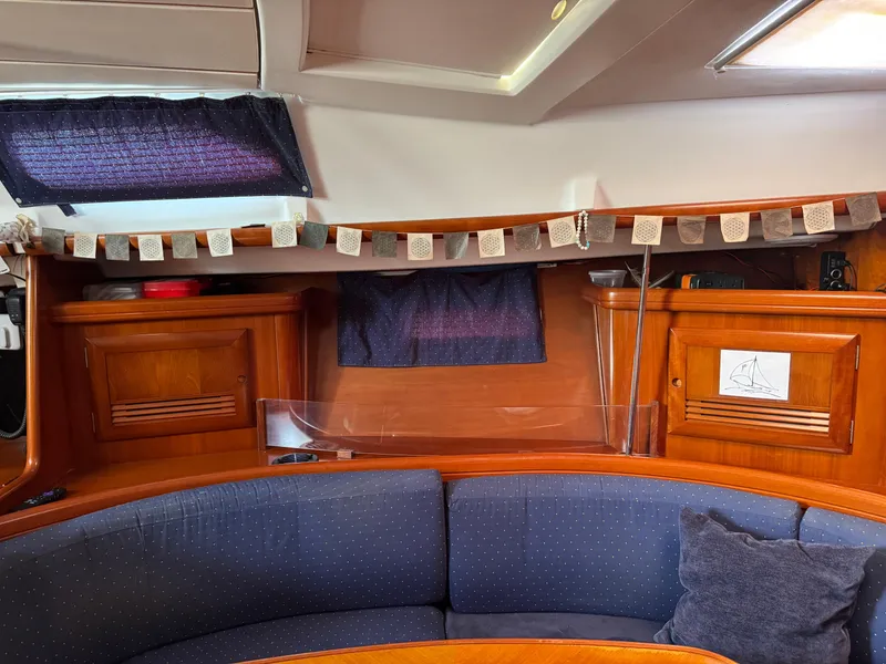 Slide: The Image of Interior of a 2002 Beneteau Oceanis Clipper 393 sailboat with cozy seating area. - 21
