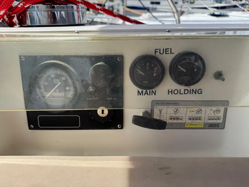 Slide: The Image of Control panel of a 2002 Beneteau Oceanis Clipper 393 sailboat, showing gauges and switches. - 25