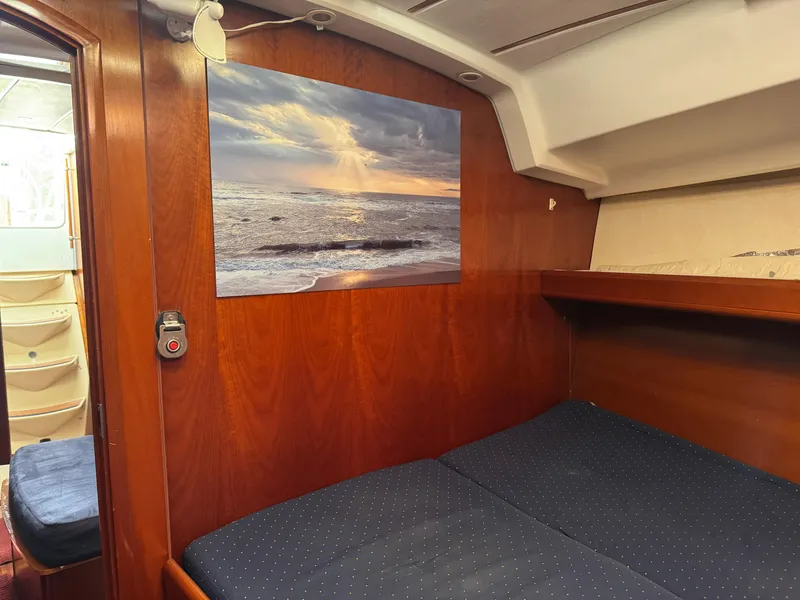 Slide: The Image of Cozy cabin interior of 2002 Beneteau Oceanis Clipper 393 with ocean artwork. - 3